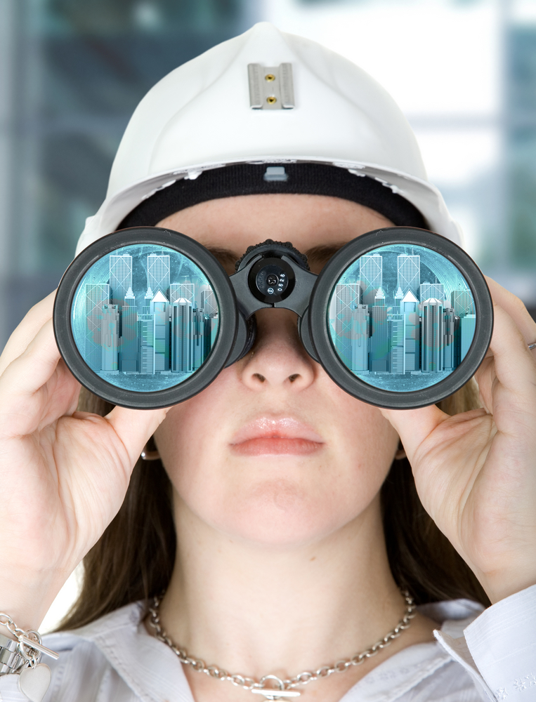 female architect vision - corporate buildings in binocular lenses